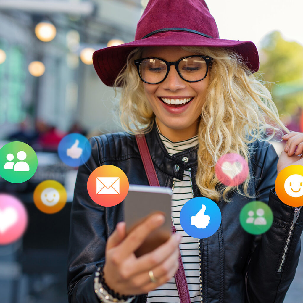 Woman Looking At Phone With Engagement Icons